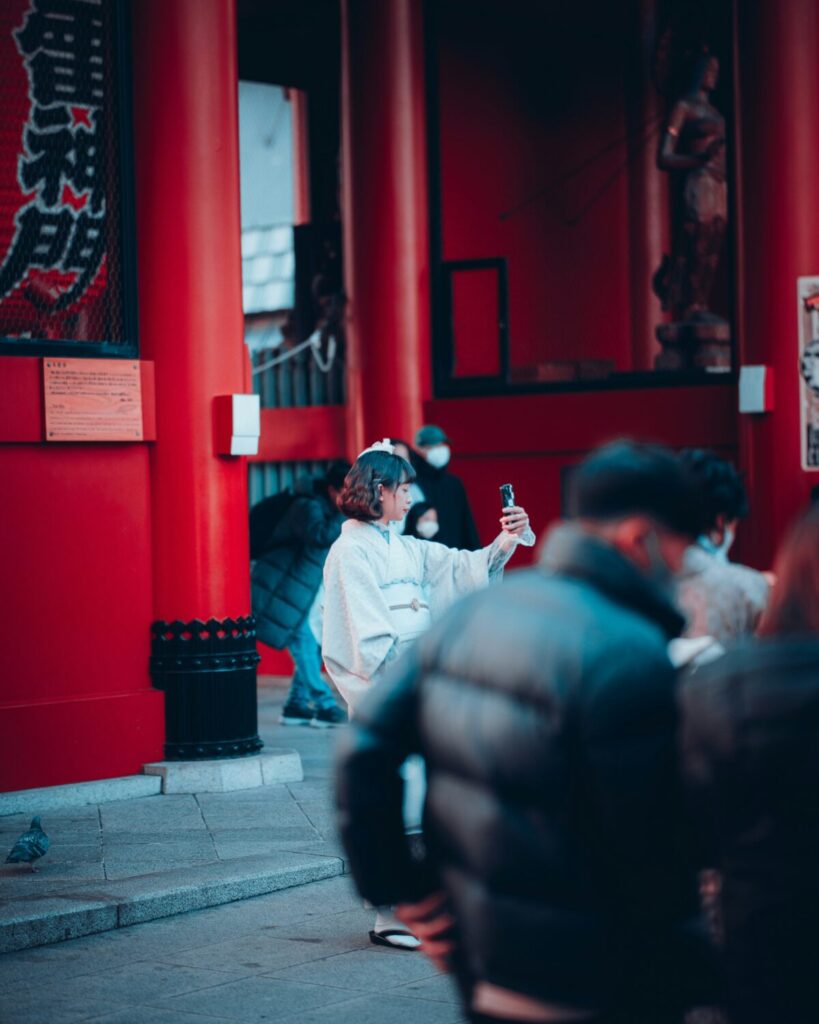 A lady using her phone in Japan