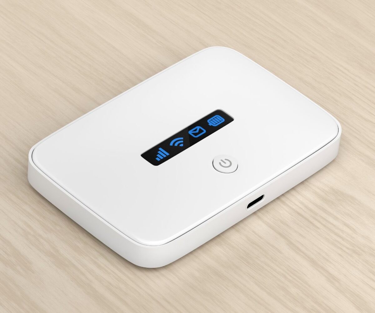 This image shows a small portable Pocket WiFi device siting on a table.